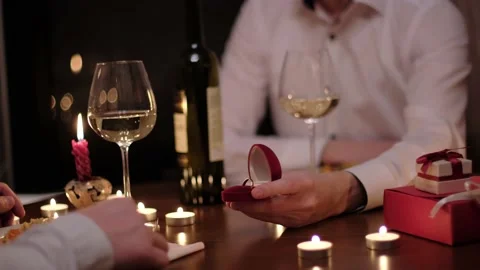 A man proposes to his partner to marry during a romantic dinner Stock-Footage 149421824