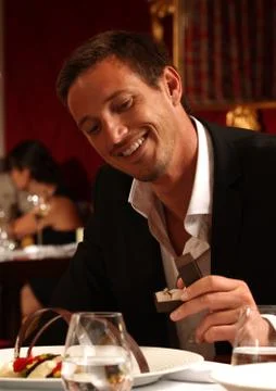 A man proposing with a wedding ring at dinner Stock Photos