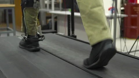 Man with prosthesis leg exercising on treadmill Stock Footage 93519947