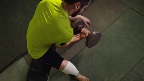 Man with Prosthetic Foot Lifting Dumbbell Stock Footage 72139781