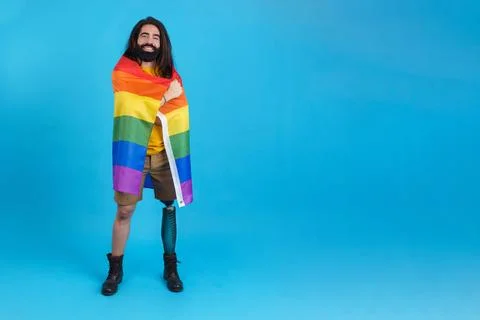 Man with a prosthetic leg wrapped in a lgbt flag Stock Photos