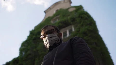 Man in Protective Face Mask Looking Down at Camera Stock-Footage 132502235