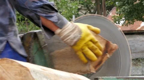 Man with protective gloves cutting trees on circular saw, close up, firewood, 4K 스톡 동영상 55878087