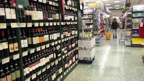 Man in a protective mask choosing alcohol Stock Footage 130247034