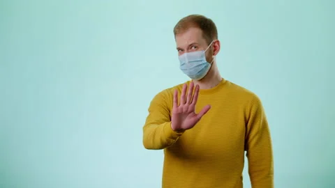 Man In Protective Mask Disapproving With No Hand Sign Make Negation Gesture Stock Footage 170190949