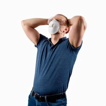 Man in a protective mask isolated on a white background. Stock Photos