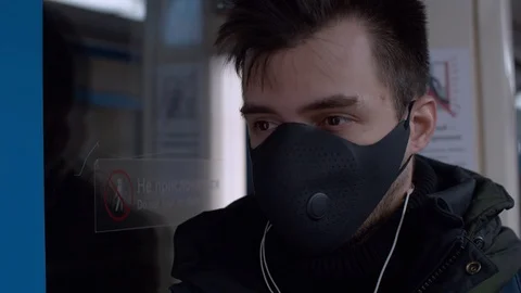 Man in protective mask in subway Stock Footage 126984307