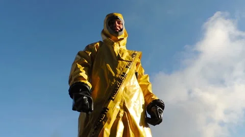 A man in a protective suit on a background of smoke, chemical biological prot Video stock 49071934