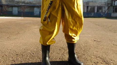 A man in a protective suit on a background of smoke, chemical biological prot Stock-Footage 49071962