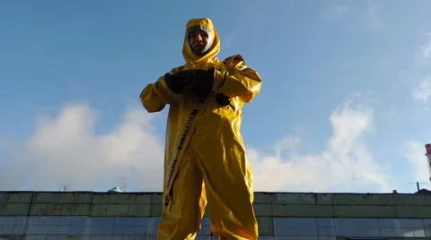 A man in a protective suit on a background of smoke, chemical biological prot Video stock 49071963