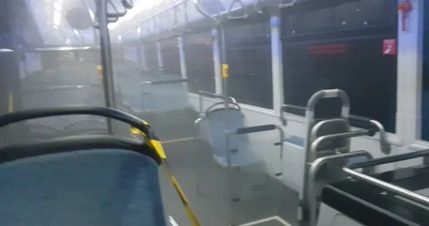 Man In Protective Suit Decontaminating A Bus During Virus Outbreak Stock Footage 131050113