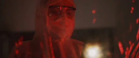 Man in protective suit with mask and glasses,taking a picture with a phone Stock Footage 126357682