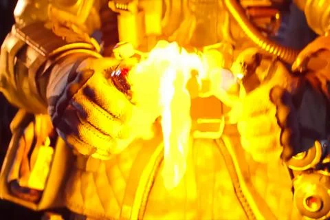 Man in a protective suit sets fire to a Molotov cocktail. Stock Photos