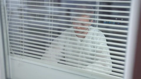 Man in protective workwear and glasses sit and write something in the laboratory Stock Footage 123667076
