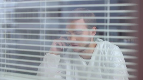 Man in protective workwear talk on phone in the laboratory Stock Footage 123689987