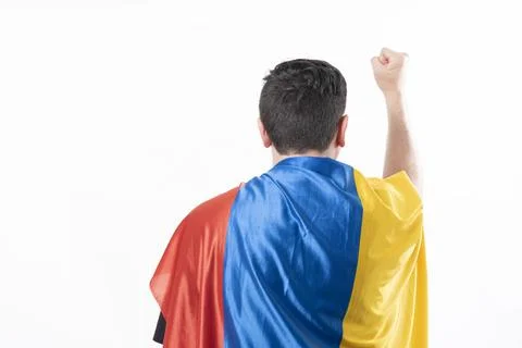 Man protesting from behind with flag of Colombia Stock Photos