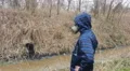 man with a protetctive mask  toxic water factory pollution HD Footage
