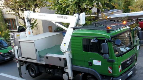 Man pruning trees using a lift Video stock 32379007