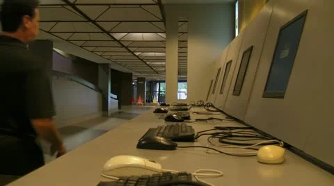 Man at public computer stations 2 Stock Footage 10901385