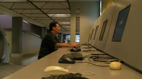 Man at public computer stations 3 Stock Footage 10901405