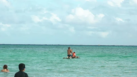 Man on puddle board riding the waves in a sea. Slow motion. Stock Footage 169182197
