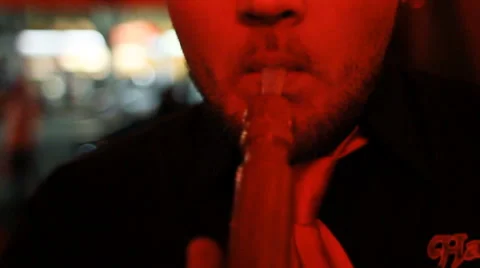 Man puffs on hookah pipe Stock Footage 61724737