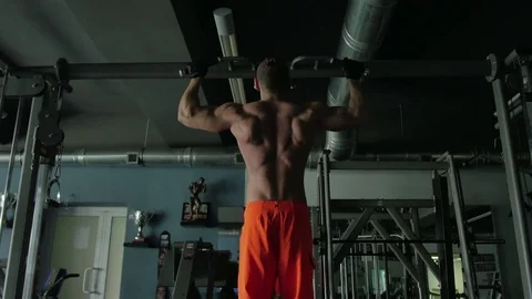 The man pulled on the bar at the gym 動画素材 70989000