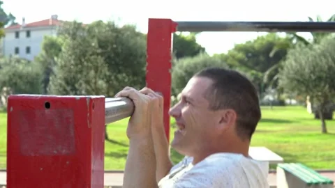 The man pulled on the bar on a summer day Stock Footage 169372080