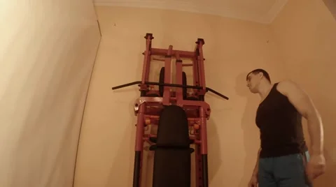 Man Pulled on the Bar on the Wall Bars in the Room Stock Footage 62475348
