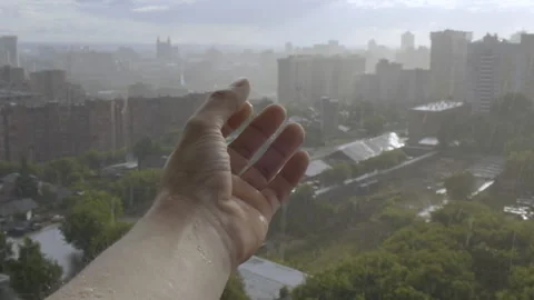 Man Pulled left Hand under Heavy Rain. Hand of Wet. Catching raindrops. Feeling Stock Footage 134378653