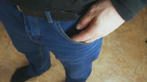 The man pulled out of his jeans pocket a bag of marijuana. 스톡 동영상 128842063