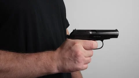 Man Pulling Back Handgun Slide Pulling Trigger and Engaging Safety Stock-Footage 340405592