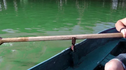 Man pulling a blue boat with oar, faceless Vidéo 67560766