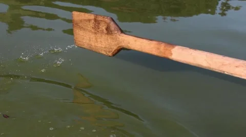 Man pulling a blue boat with oar, faceless Vidéo 67560872