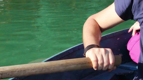 Man pulling a blue boat with oar, faceless Vidéo 67560911