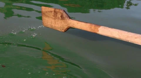 Man pulling a blue boat with oar, faceless Vidéo 67560950