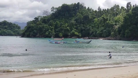 Man pulling boat with rope Stock Footage 206371767