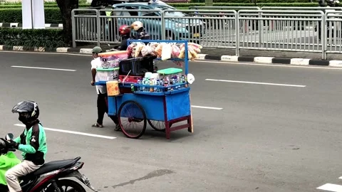 Man pulling a cart filled with merchandise Stock Footage 171054422