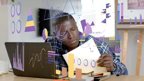 Man pulling chart, comparing with laptop while animated charts overlay, checking Stock Footage 333211029