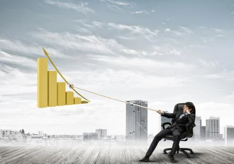 Man pulling with effort big pulling rope graph, as a symbol of financial growth Stock Photos