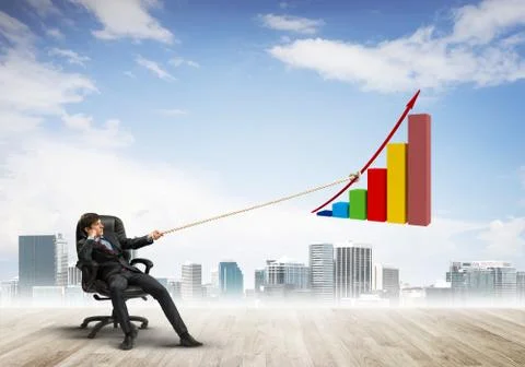 Man pulling with effort big pulling rope graph, as a symbol of financial growth Stock Photos