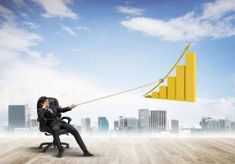 Man pulling with effort big pulling rope graph, as a symbol of financial growth Stock Photos