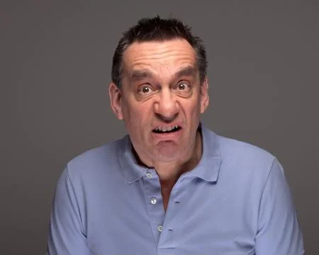 Man pulling funny grimace face Stock Photos