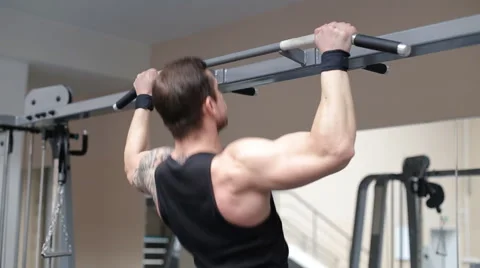 Man pulling up in a gym Stock Footage 62562643
