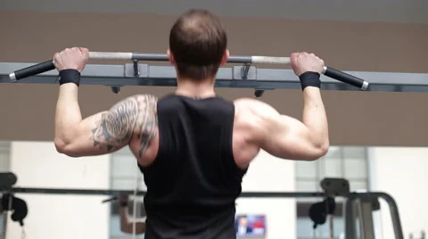 Man pulling up in a gym Stock Footage 62562716