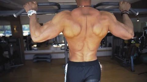 Man pulling up in a gym Stock Footage 78169044