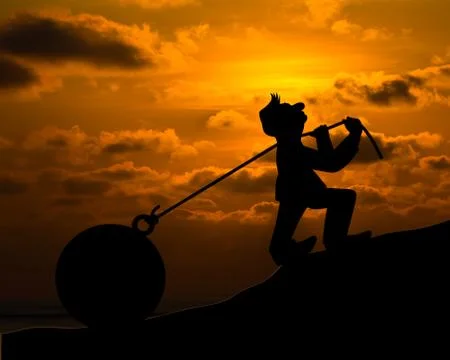 Man with pulling a heavy load ball silhouette Illustrazione stock