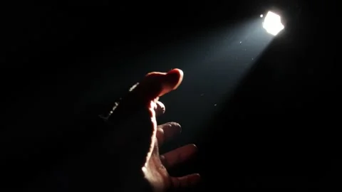 Man pulling his hand towards the light Video stock 160824518