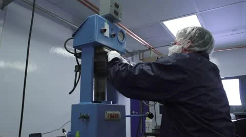 Man Pulling Machine Lever in Cleanroom low angle MS Stock Footage 10895929