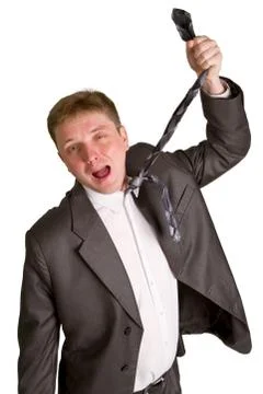 Man pulling necktie out to choke himself while making facial expression Stock Photos
